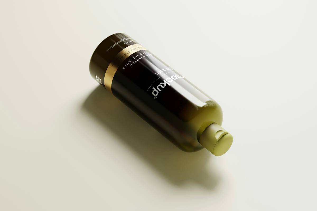Hair sleek elixir being applied to damp hair strands for frizz control